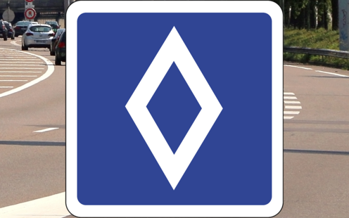 Panneau de signalisation : losange blanc sur fond bleu